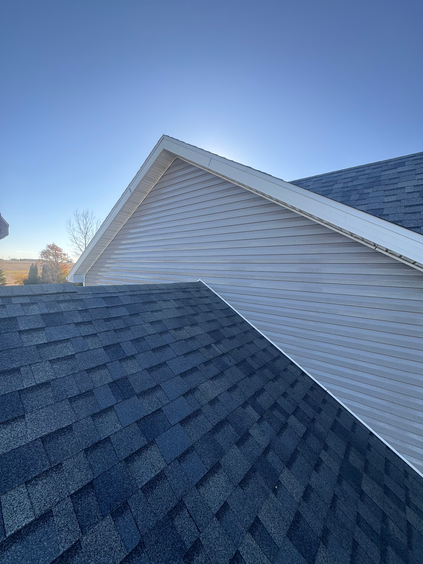 Upper gable siding cleaned after washing