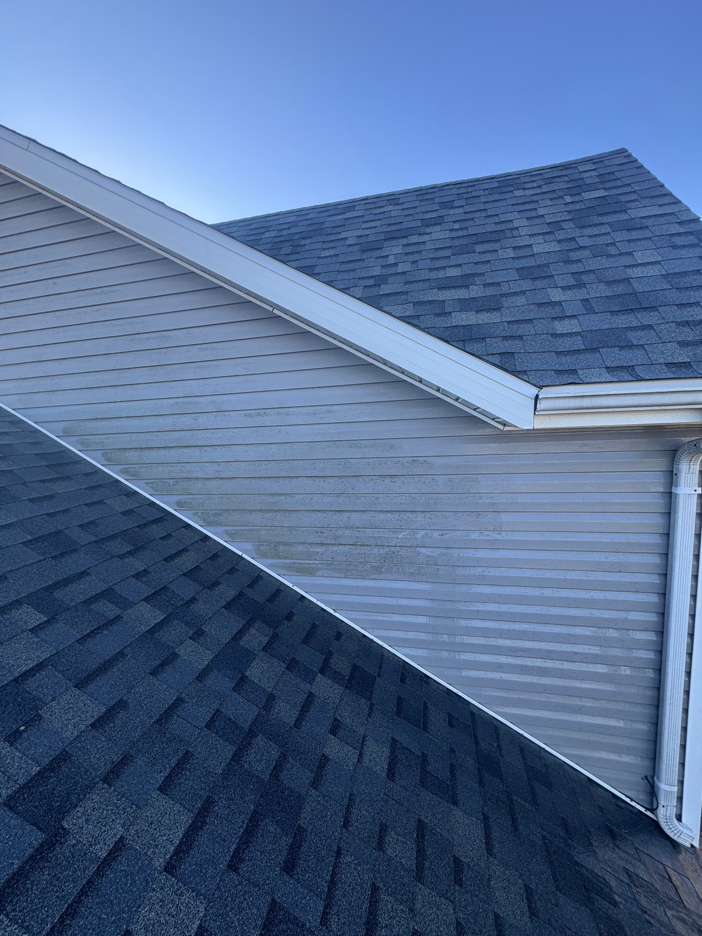 Upper gable siding with staining before washing
