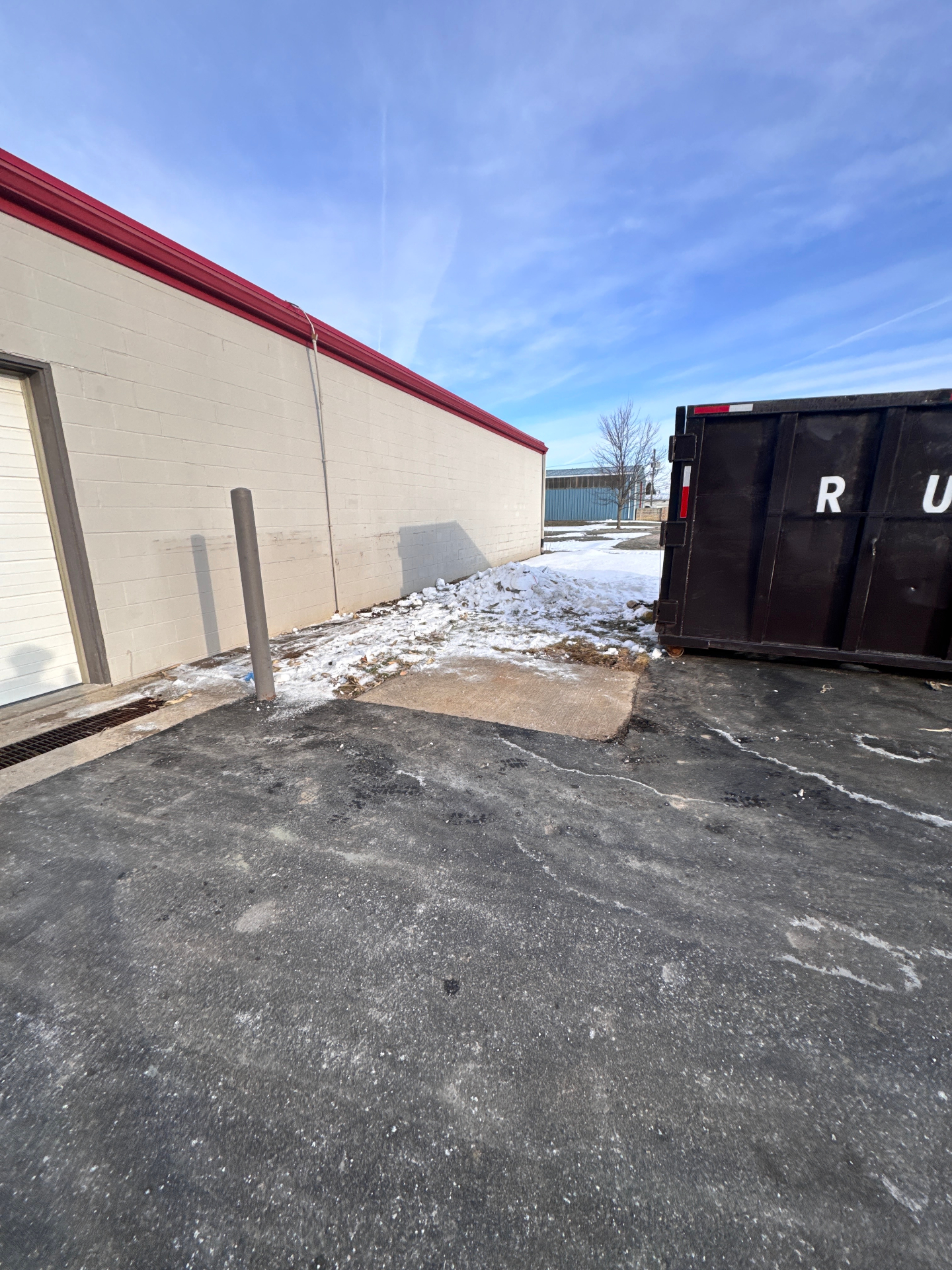 Commercial building exterior cleared of pallets