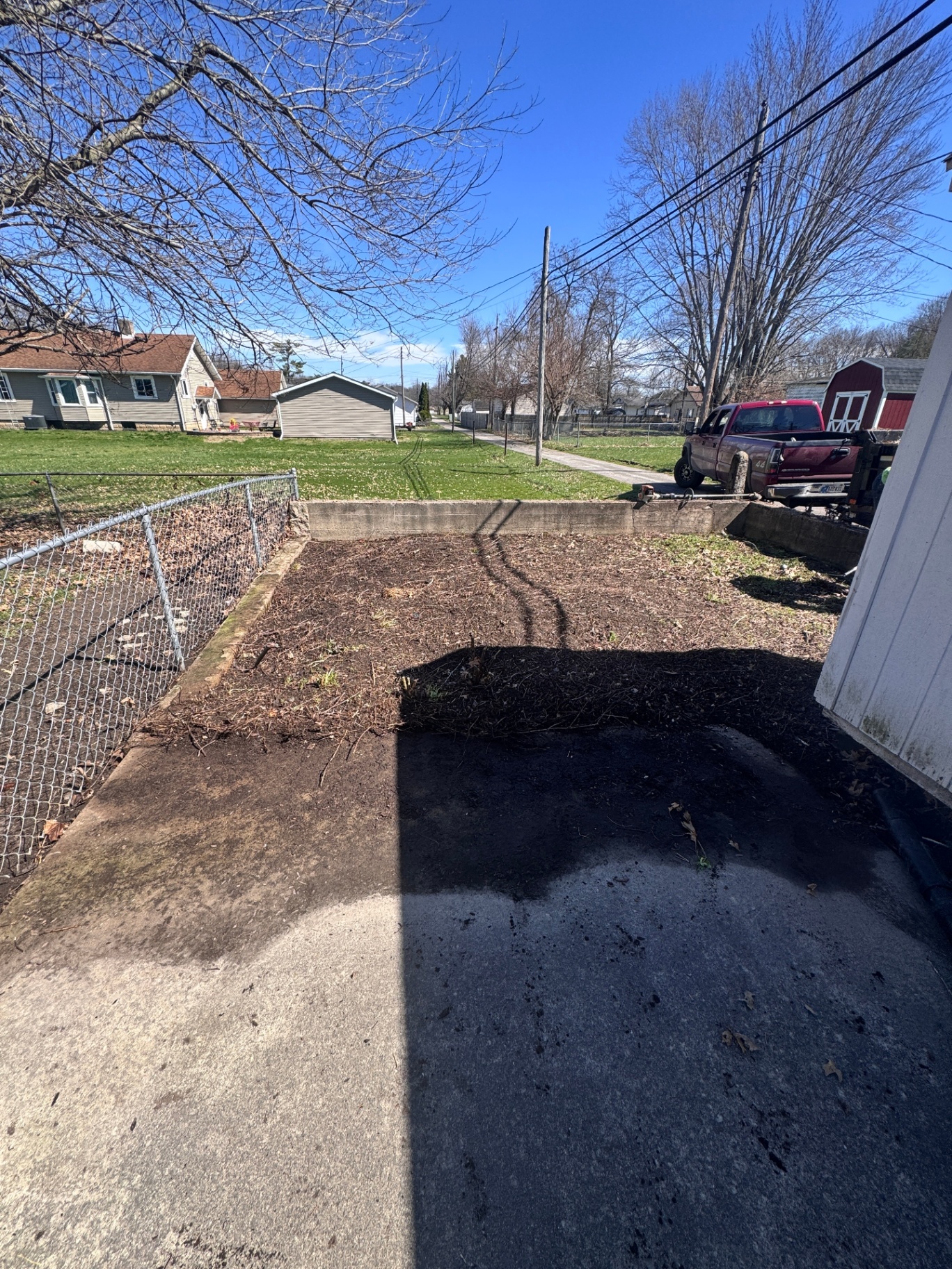 Cleared driveway after brush and trash removal