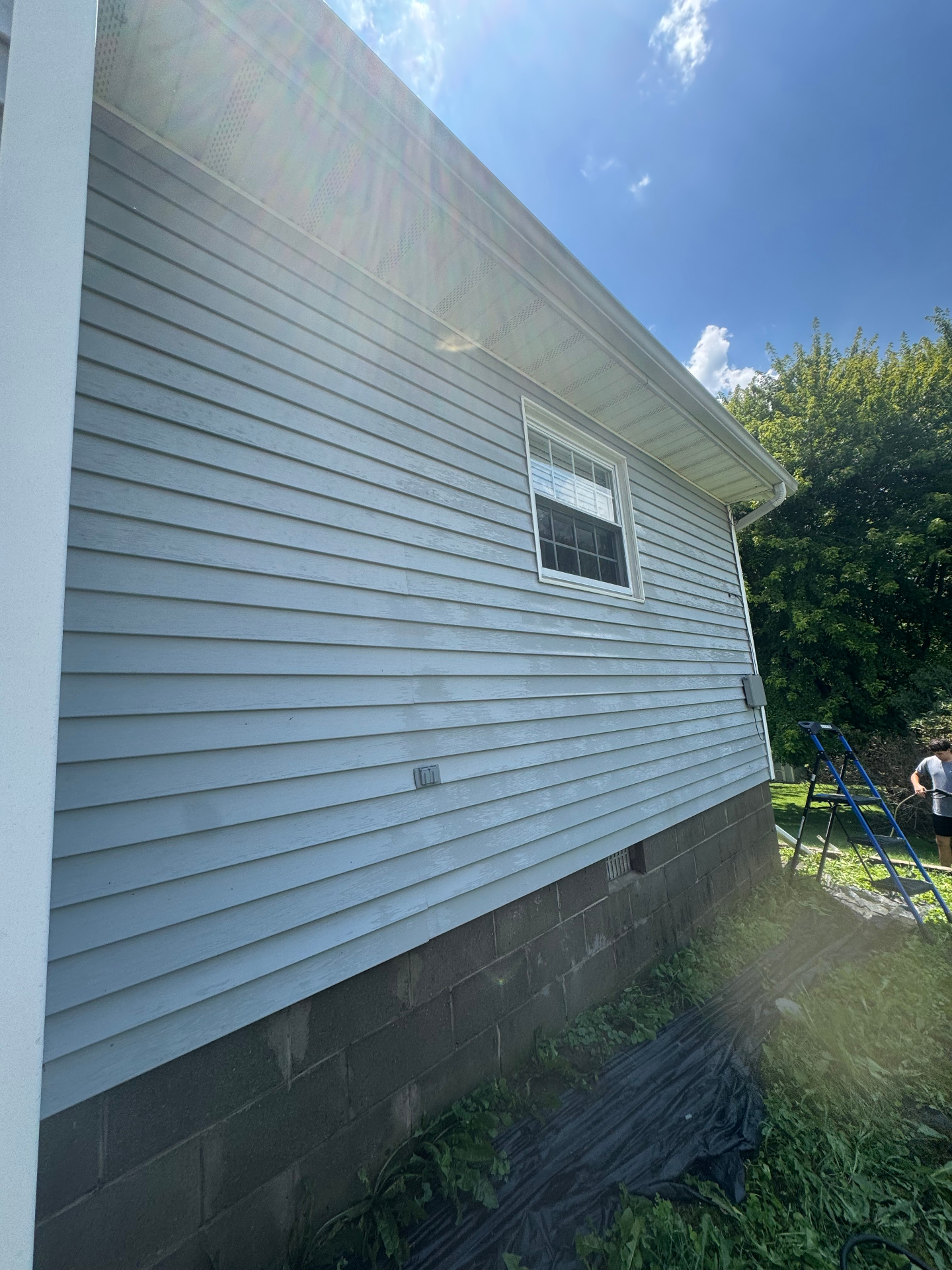 Bright white vinyl siding after pressure washing