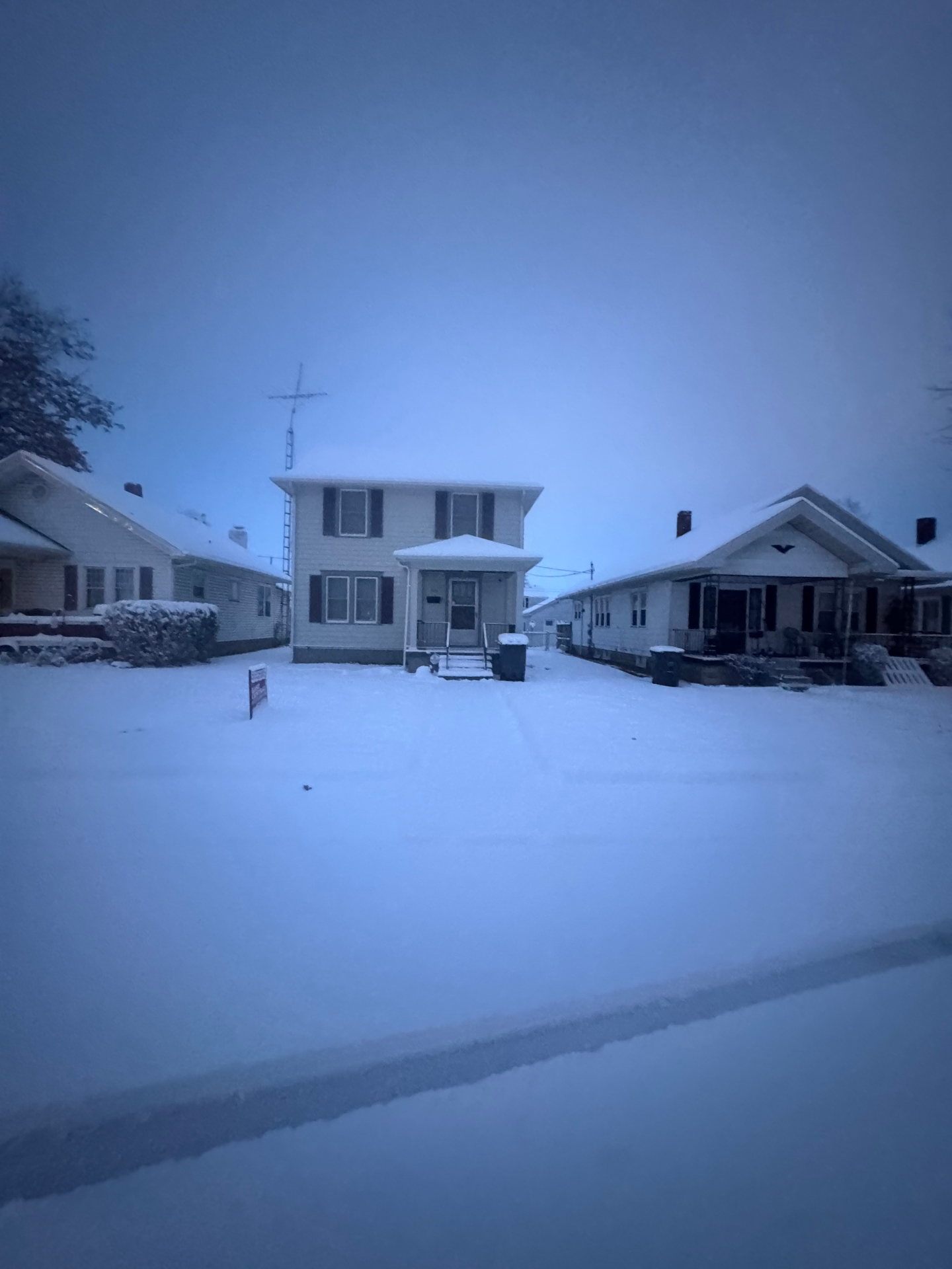 Snow-covered walkway before clearing